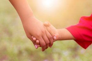 Image of siblings holding hands to illustrate the Uniform Transfer to Minors Act