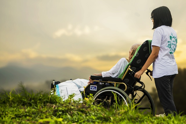 Picture of woman pushing a person in a wheelchair