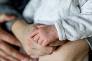 Multigenerational family holding hands