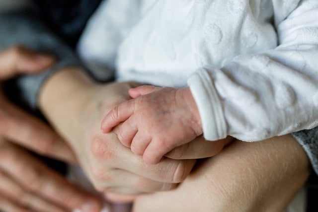 Multigenerational family holding hands