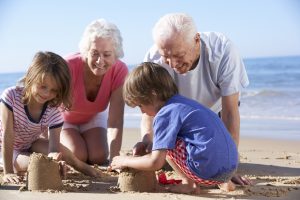Image of a family at the beach to illustrate the importance of estate planning to preserving your legacy and protecting your family.