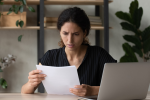 Photo of a woman reading a letter that represents a Crummey Notice