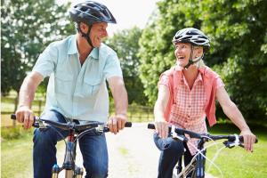 Image of a happy couple riding bikes to illustrate Estate Planning for Empty Nesters.