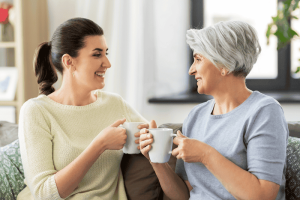 Photo of mother speaking with grown daughter to illustrate the talking to family about estate plan.