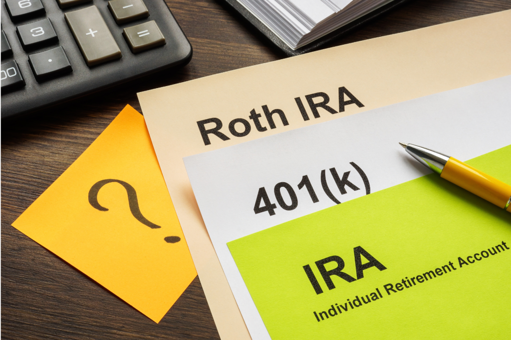 Image of a stack of papers, with each having the title of Roth IRA, 401k, or IRA. This represents the opportunity to choose a strategy and use Roth Conversions for legacy planning