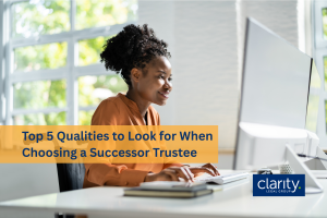 Photo of a woman using a computer with a neat desk to represent some of the top 5 qualities to look for when choosing a successor trustee