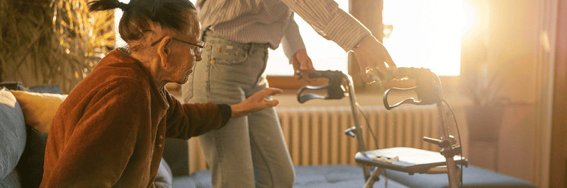 Image of an older woman getting help to stand. This illustrates a need for legal documents to protect her and her loved ones. At Clarity Legal Group®, we help individuals and families across Chapel Hill, Durham, Raleigh, Cary, and surrounding North Carolina counties put the right legal protections in place such as power of attorney and healthcare documents.
