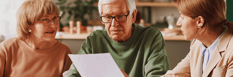 Family reading a legal document to illustrate the importance of wills in north carolina